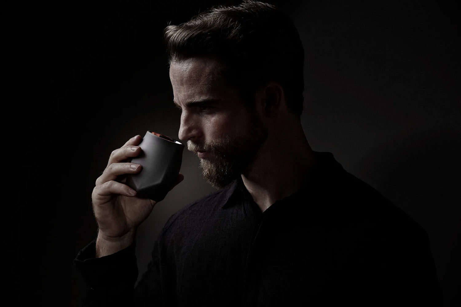 Close-up of a whiskey enthusiast nosing a VAILD Edition Norlan Glass, emphasizing aroma isolation and blind tasting ritual