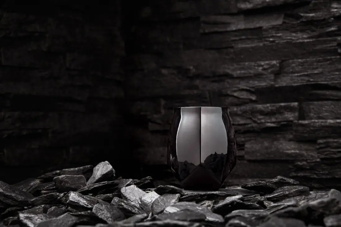 Mirror Black Norlan Steel Tumbler in dramatic stone setting
